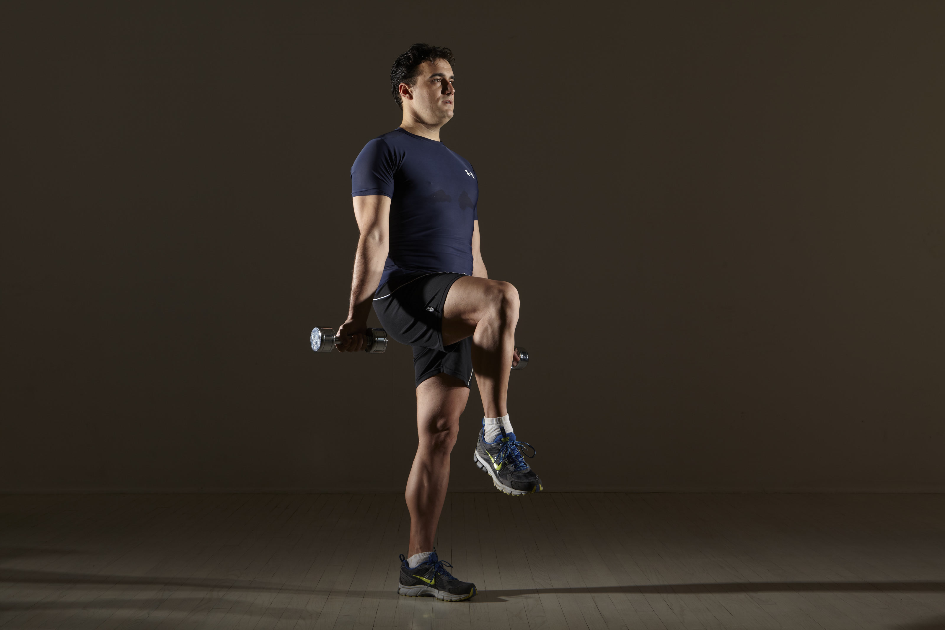 Michael Gonzalez-Wallace demonstrating a weighted balance exercise